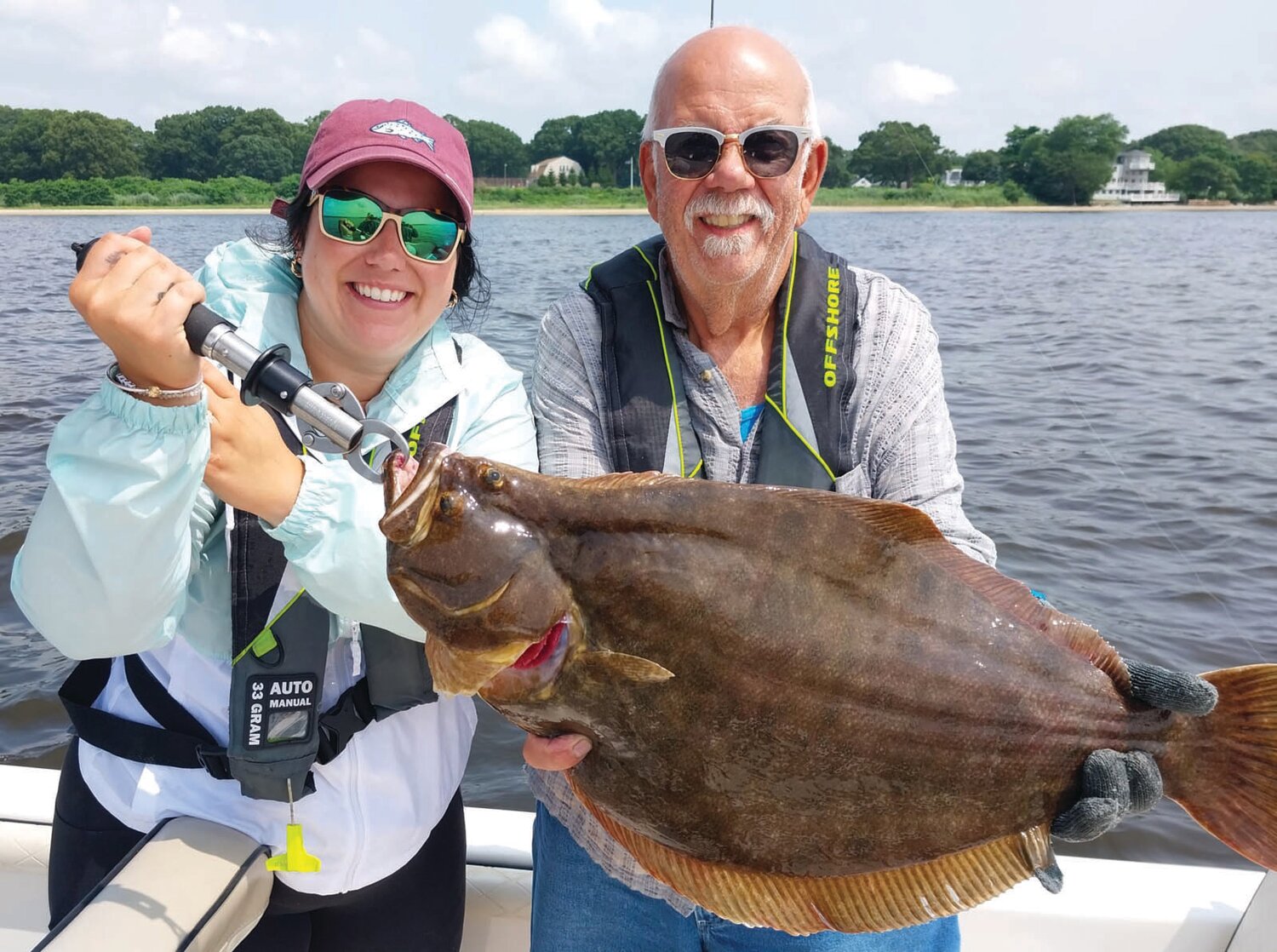 FAMILY FISHING: Shaina Boyle and her father Gary Vandemoortele both of Smithfield, RI with the 27-inch summer flounder Shaina caught fishing the Newport Bridge area last week. (Submitted photo)